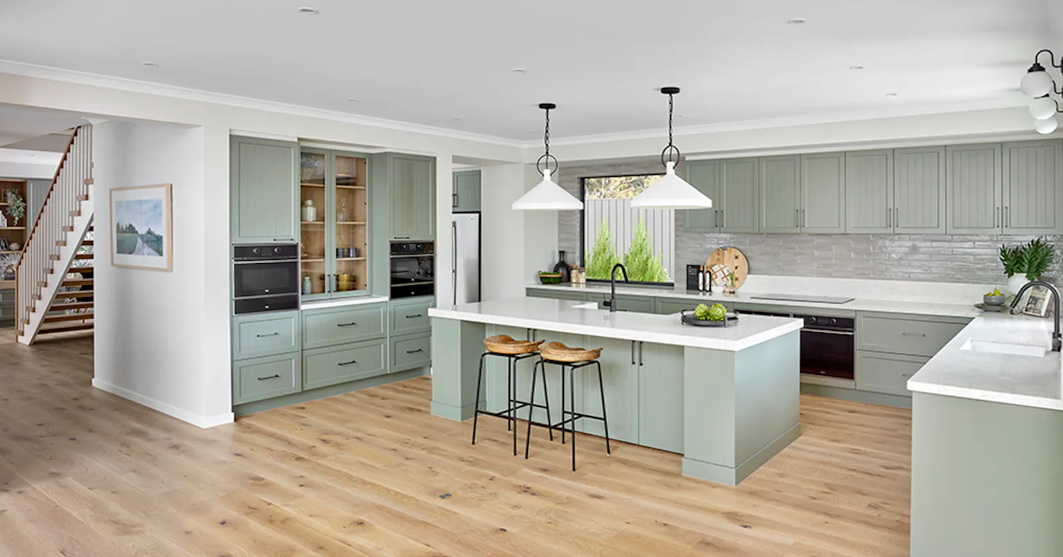 3. The open Hamptons kitchen of the Sovereign 54 in Victoria uses green to make a statement
