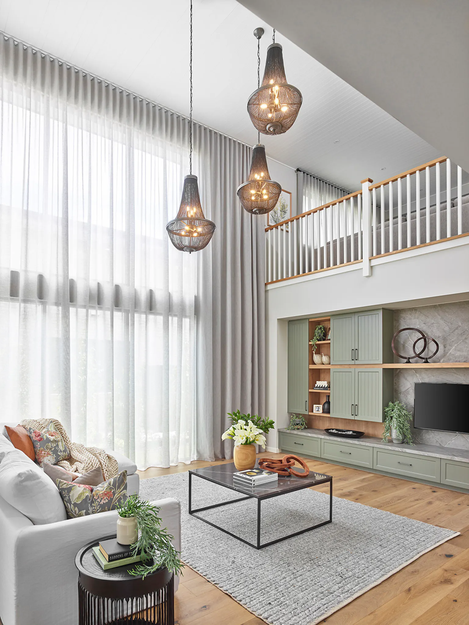 7. An open plan living area with a void on display at the Sovereign 54 in Greenvale, Victoria